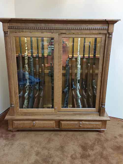 Amish custom made gun cabinet with shallow based drawer storage