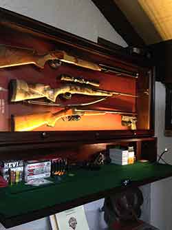 The custom gun cabinet had a flip down lower storage cabinet