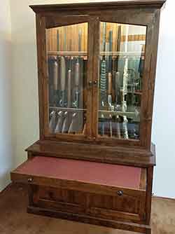 Front view of Gun Cabinet with Cleaning Shelf Extended