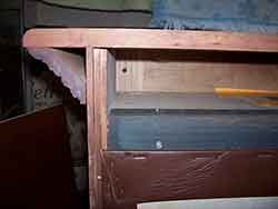 This pistol display cabinet has solid wood top, bottom, and sides