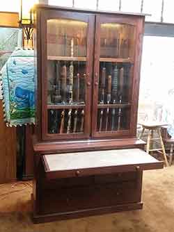 Custom Long Gun Cabinet with Pull Out Cleaning Shelf