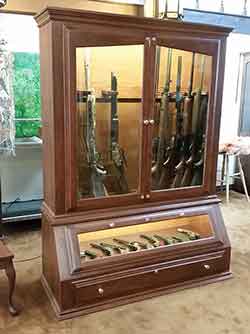 Angle view of our Cherry Gun Cabinet and Pistol Display