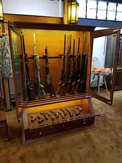 Rifles, Shotguns, and Pistols in Custom Gun Cabinet with LED on