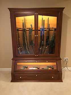 Chery Gun Cabinet with Side Display of Rifles and Shotguns