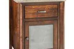 Here is a 23" vanity bath cabinet. The off white counter top and fixtures can be changed to suit your needs.