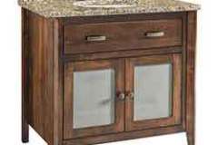 The brass fixtures can be changed to about any style you would like in this 36" custom bath vanity. It is complete with overlay doors and an adjustable shelf inside.
