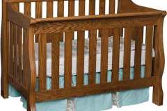 Our custom slat style convertible crib is easy to change to a day bed and then a regular bed when the time comes. The back panel is 45" high and the front panel is 38" high.