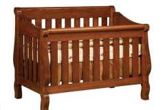 This is our Hoosier custom sleigh crib with the slatted sides. This is our most popular style of convertible crib.
