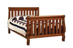 Here you see our custom Hoosier Sleigh Crib. It easily converts to a toddler bed and a double bed as well. You can also get the guard rail if needed.