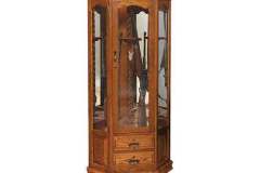 The arched door corner gun cabinet features center carousel with turned rope column, LED interior lighting, and mirrored back to show off the guns from all viewing angles.  Bottom drawers feature full extension side mount glides and dovetailed construction.