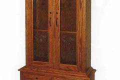 One of our original styles, the Heritage Gun cabinet works well in almost any decors.  Feature two raised panel display doors and four raised panel full extension drawers.