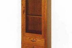 The Chimney gun cabinet provides a gorgeous means of displaying your gun collection when space is limited.  Crafted with soft arch glass upper and two full extension lower drawers.