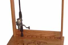 This fishing rod holder was crafted to display up to 10 rods and provides a lower pull out drawer to safely store all of our fishing accessories close by.