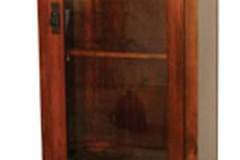 Shaker style gun cabinet crafted with flush mount doors and drawers.  Both long gun display and the lower pistol or knife display comes standard with LED lighting.