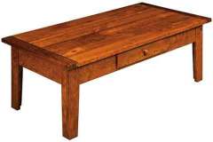 This is our custom built Homestead coffee table. It is made with a plank top and bread board ends as well.