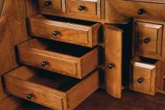 Look at all the drawers under the roll top of the custom Amish crafted Deluxe roll top desk. This is seen in Cherry wood.