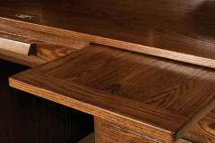 This is showing the writing pullout in the custom Amish Farmer's Roll top desk.