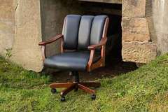 Custom Amish Midland Arm desk chair. It is shown in Cherry wood with black leather.