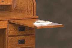 This pullout is standard on our Amish mission roll top desk. There is one on both sides for your convenience.