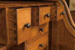 These are just some of the cubby holes on our Mission Heritage Amish Roll top desk. The stain and knobs can be changed easily.