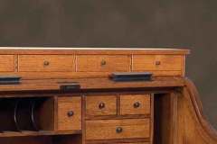 This is an Amish made single pedestal roll top desk. The space under the roll top can be designed how ever you need it to be.