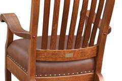 The back of our Amish Custom Clients chair features tack finish along the seat and upper head rest.