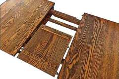 Here is another picture of the custom Amish made butterfly table leaf. This style leaf is an option on all tables but its well worth the extra cost if you don't want lift regular leaves out of your table.
