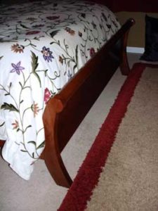 Close Up of Curved Panel Sleigh Bed Foot Board
