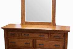 The beveled glass in the mirror highlights this custom crafted Homestead dresser.