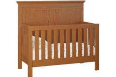 The Haven style convertible crib that is Amish crafted is shown here in Sap Cherry wood with Asbury stain. Cribs can be crafted to convert into a bed and daybed.