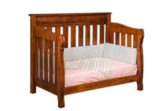 Shown with the conversion toddler bed is our custom Castlebury Crib. You can get the mattress and pads as well or provide your own. They are essentially all the same size.