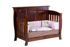 This is the Cayman style crib converted into a toddler bed. It also has the mattress and bumper pads with it if you need them.