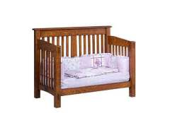 The custom McCoy crib is shown here that has been turned into a toddler bed.