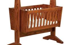 Our Amish Mission Baby Cradle and Cradle Pad are shown here. It can be locked in placed or used as a swinging cradle.