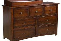 Our Amish made Monterey 7-drawer dresser is 56" wide and 34" high. This one is shown in Cherry wood with the Box Top and the Changing Pad.