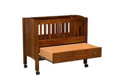 This custom Amish Bassinet and drawer are shown in Elm wood with Michael's Cherry stain.