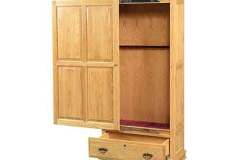 Show is our single door sliding front gun cabinet crafted out of solid red oak with a honey stain finish.  The door slides completely open to allow easy access to your long gun collection.