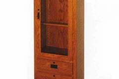 Amish crafted Mission Single Door gun cabinet with flush mount doors and drawers.  Shown crafted out of red oak with mission cast hardware. Upper cabinet features shaker mullions on upper glass.