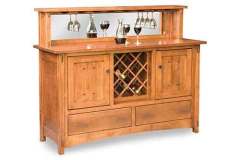 This custom designed Amish Crestline wine bar cabinet holds all of your wine bottles and glasses. It includes a mirrored back as well on the backsplash.