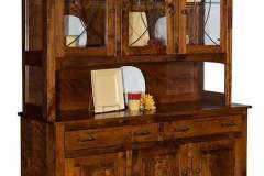 The custom Amish Hackenburg hutch is shown. Complete with leaded glass top door and framed flat panel lower doors.