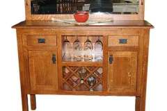 Here is our custom Amish built Lincoln sideboard. It is shown with wine bottle and glass holders.