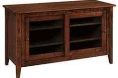 This 2 door custom Amish built tv cabinet is shown here in Oak wood with Tavern stain. You can stain it just about any color you would like to match other pieces in your home.