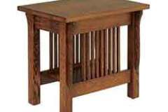 This elegant end table is a Mission style and is done in Cherry wood.