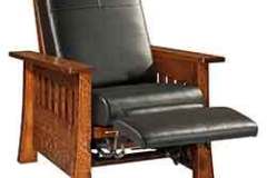 Black leather highlights this Mission recliner with the padded footrest.