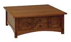 Seen here is our Amish built 42" square cabinet coffee table. It is made with Cherry wood.