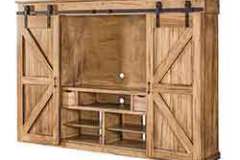 This is our Amish built custom wall unit with the sliding barn doors. If you need a large space filled, this is what you should use for your entertainment system.
