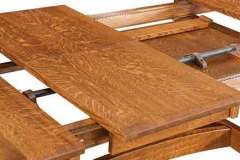 This is showing the Iva dining table with both a butterfly leaf and a standard leaf. It is seen here is 1/4 Sawn Oak wood.