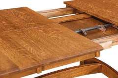 What you have here is our custom Amish built Iva trestle dining table with a butterfly leaf. This leaf folds in half neatly and stores under the table top.