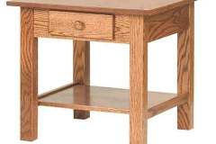 This Amish built Open Mission end table is complete with a drawer and a shelf underneath. It is seen here is Oak wood with a light stain.
