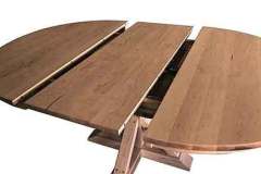 A butterfly leaf Amish built table is just right for someone who can't lift very much anymore. It conveniently folds in half and stores under the table top for easy access to it. It can be made in various woods with many choices of stains.